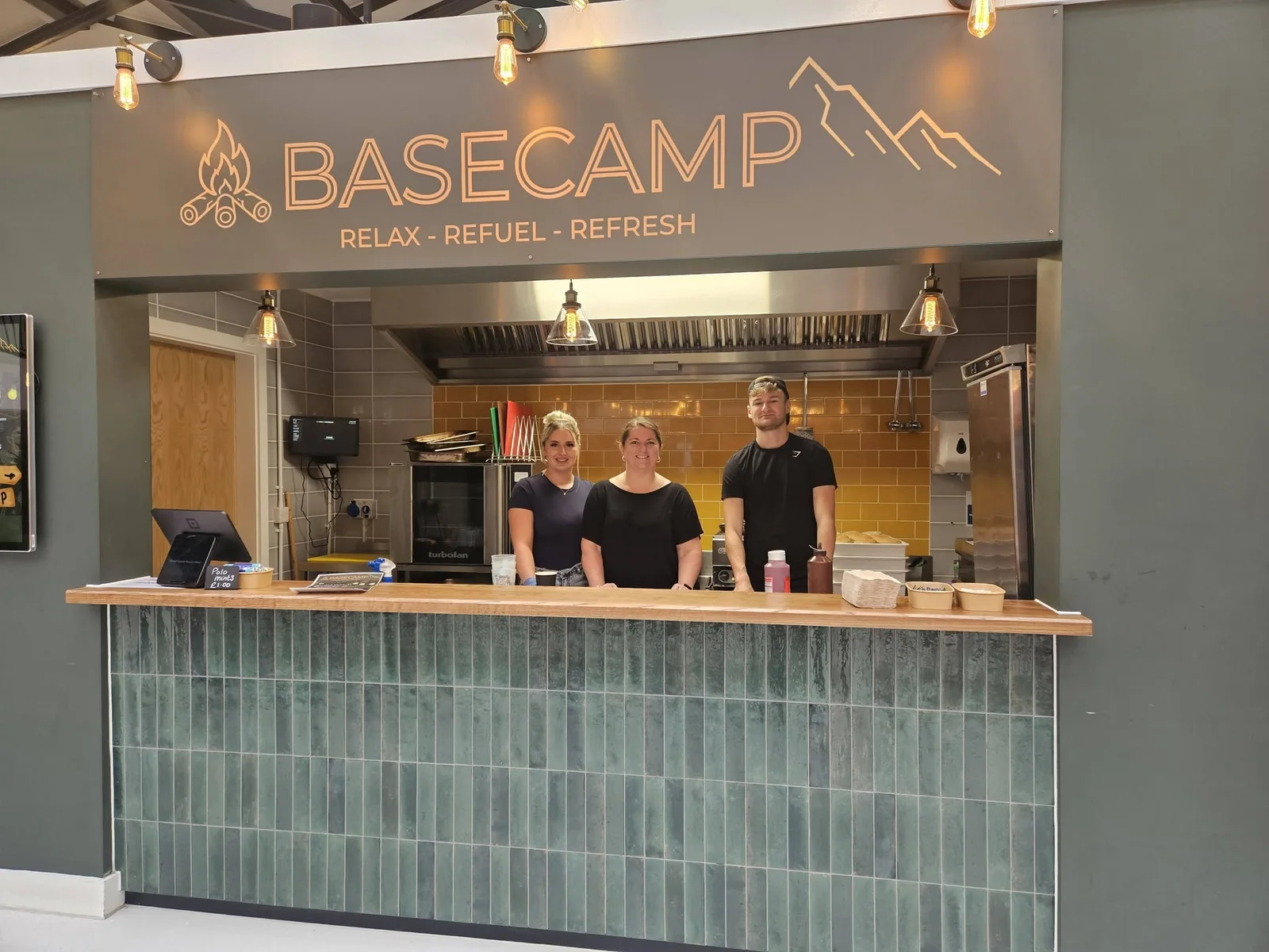The Basecamp team at their counter in Colne Market Hall